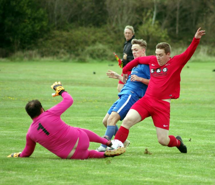 Bridges Will Haworth is denied by some stern defending from Pennar Robins